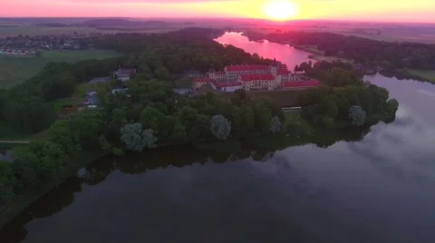 Aerial View. Flying over the castle's old town at sunset with sun rays. Stock Footage 63836247
