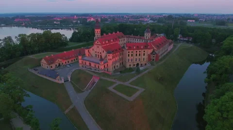 Aerial View. Flying over the castle's old town at sunset with sun rays. Stock Footage 63836272