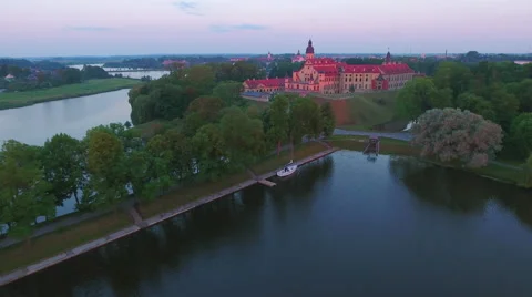Aerial View. Flying over the castle's old town at sunset with sun rays. Stock Footage 63836629