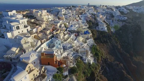 Aerial view flying over city of Oia on Santorini Greece 4K Stock Footage