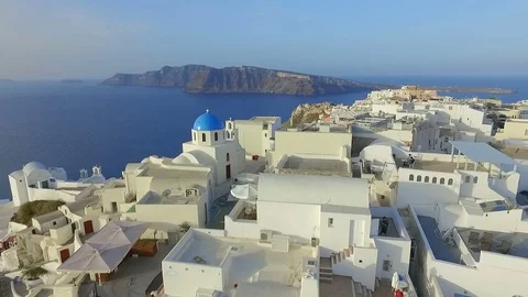 Aerial view flying over city of Oia on Santorini Greece HD Stock Footage