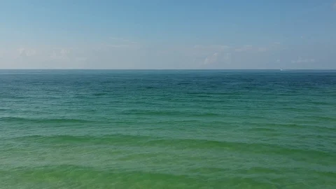 Aerial View Flying Over Clear Blue Sea Stock Footage 129383980