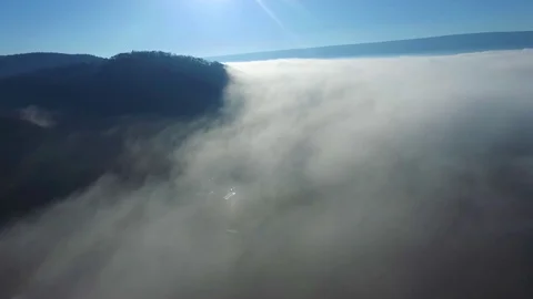 Aerial View Flying Over Clouds on Hilltop Stock Footage 129269092