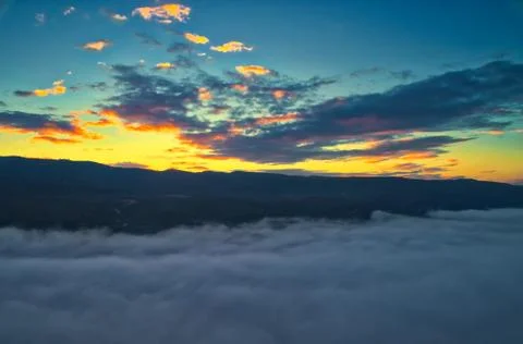 Aerial View. Flying over the clouds . Stock Photos
