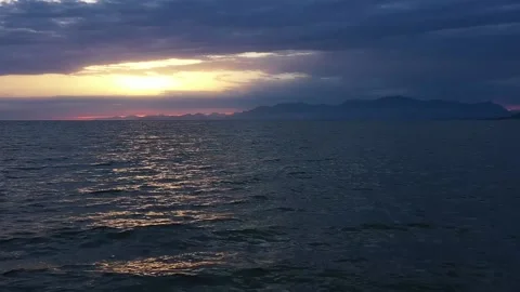 Aerial view flying over the coast near Naples during beautiful sunset Stock Footage 133836244