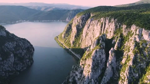 Aerial view flying over the Danube river gorge Iron Gates, nestled between the Stock Footage 344728995
