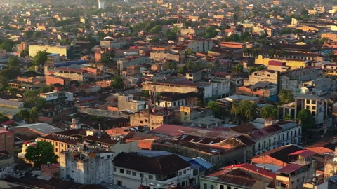 Aerial view flying over dense urban landscape of Iquitos, Peru. Citys rooftops Stock Footage 324276131