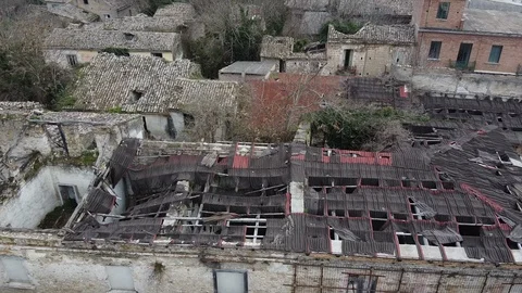 Aerial View Flying over a destroyed and abandonated city Stock Footage 123604912