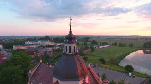 Aerial View. Flying over the dome of the church with a cross in the city at suns 스톡 동영상 63834147
