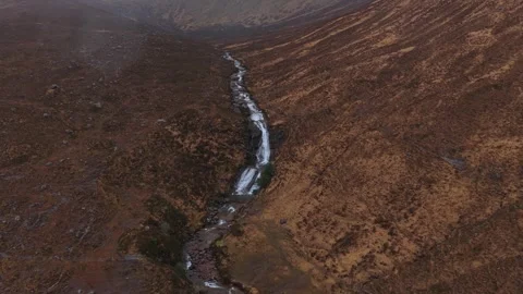 Aerial view flying over eas a' bhradain waterfall in scotland Stock Footage 334058481