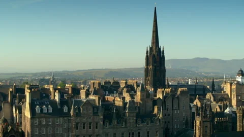 Aerial view flying over Edinburgh city skyline Stock Footage 336775872