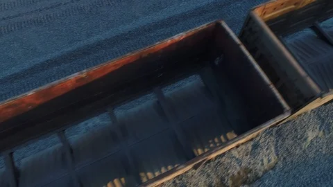 Aerial view. Flying over empty railroad cars for rubble on the rails at sunset. 스톡 동영상 94497370