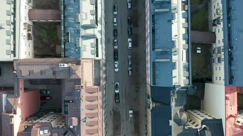 Aerial view flying over empty streets, rooftops &amp; parked cars during Coronavirus Stock Footage 131211068