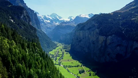 Aerial View of Flying Over the Forest into Beautiful Green Valley - No 6 Stock Footage 140797087