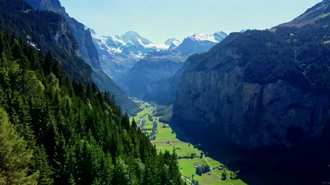 Aerial View of Flying Over the Forest into Beautiful Green Valley - No 8 Stock Footage 140797299