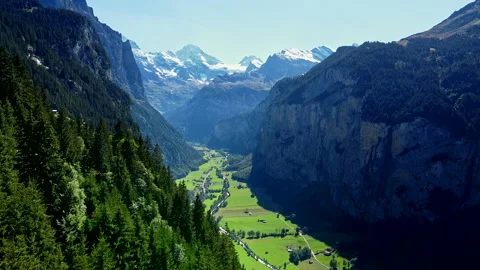 Aerial View of Flying Over the Forest into Beautiful Green Valley - No 9 Stock Footage 140797448
