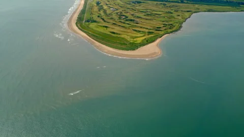 Aerial view flying over a golf course peninsula Stock Footage 336792645