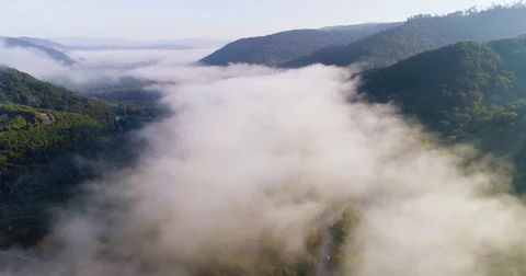 Aerial View. Flying over the high mountains in beautiful clouds . Aerial camera 스톡 동영상 82532829