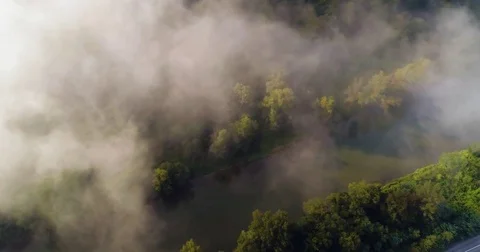Aerial View. Flying over the high mountains in beautiful clouds . Aerial camera Vídeos de archivo 82532938