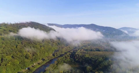 Aerial View. Flying over the high mountains in beautiful clouds . Aerial camera 스톡 동영상 82534301