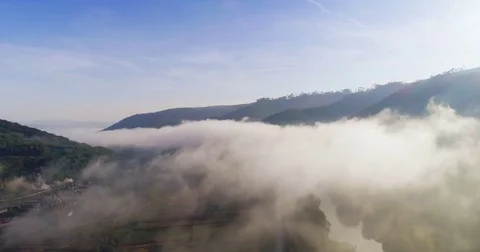 Aerial View. Flying over the high mountains in beautiful clouds . Aerial camera Vídeos de archivo 82535002
