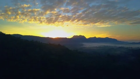 Aerial View. Flying over the high mountains in beautiful clouds morning. Video stock 83184233