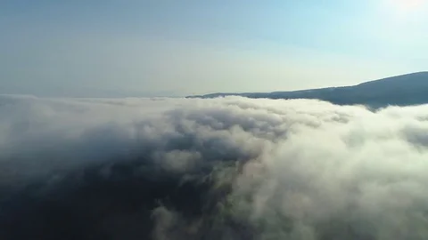 Aerial View. Flying over the high mountains in beautiful clouds . Aerial camera Vídeos de archivo 83551557