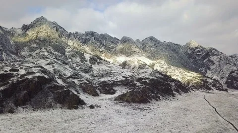 Aerial View. Flying over the high mountains at winter. Aerial camera shot. Altai Vídeo Stock 84331088
