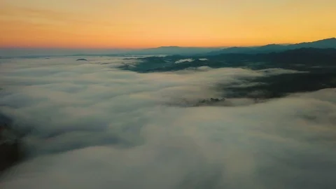 Aerial View. Flying over the high mountains in beautiful clouds morning. Video stock 87187968