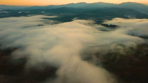 Aerial View. Flying over the high mountains in beautiful clouds morning. Stock Footage 87188908