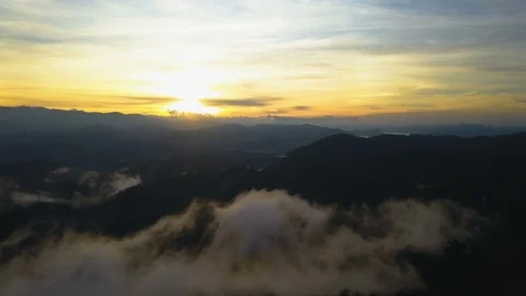 Aerial View. Flying over the high mountains in beautiful clouds morning. Video stock 87189247