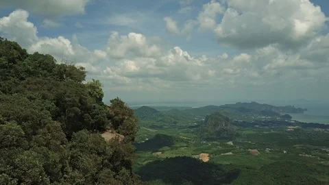 Aerial view flying over the high mountain towards beautiful seascape horizon. Stock Footage 88669932