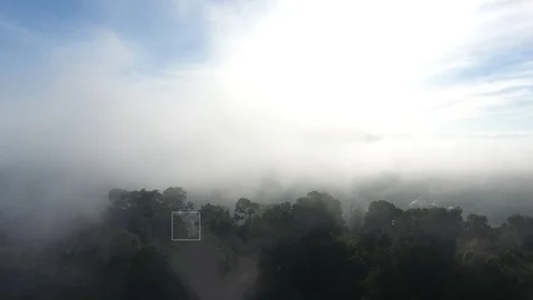 Aerial View. Flying over the high mountains in beautiful clouds Video stock 89486752