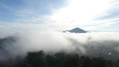Aerial View. Flying over the high mountains in beautiful clouds . 스톡 동영상 89717126