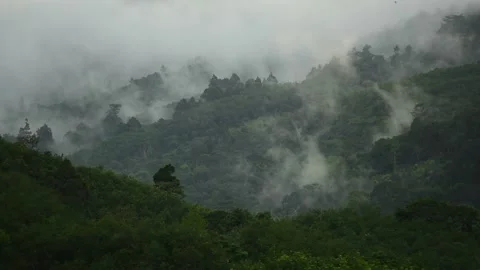 Aerial View. Flying over the high mountains in beautiful misty clouds. rain f Stock Footage 141232323
