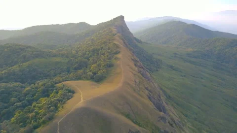 Aerial View. Flying over the high mountains, name Doi Mon Jong with beautiful su Stock Footage 153911087