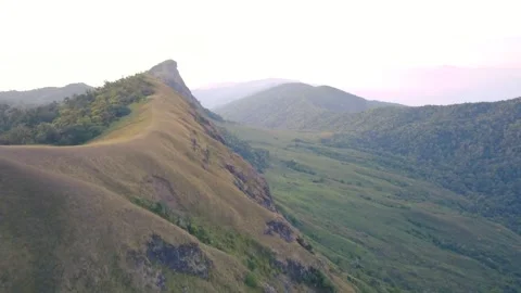 Aerial View. Flying over the high mountains, name Doi Mon Jong with beautiful su Stock Footage 245904367