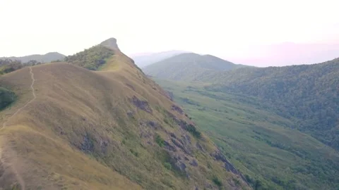Aerial View. Flying over the high mountains, name Doi Mon Jong with beautiful su Stock Footage 252111561