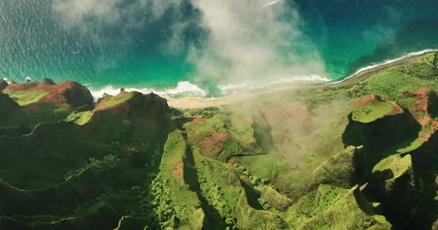 Aerial view flying over jungle mountain peaks, Na Pali coast Kauai Stock Footage