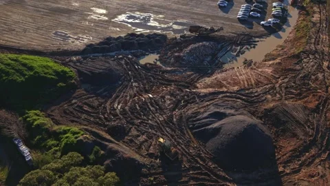 Aerial view flying over a large earthmoving construction site Stock Footage 340131677