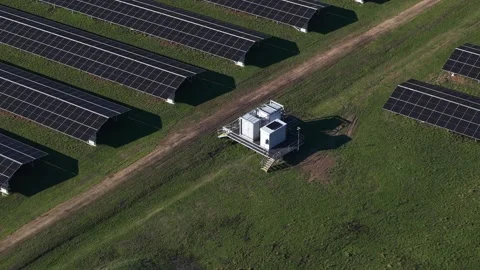Aerial view flying over a large solar power plant Stock Footage 341272244