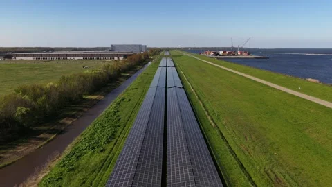 Aerial view flying over long solar panel array 스톡 동영상 333824272