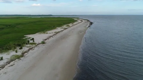Aerial View Flying over the Marsh and Delaware Bay Beach New Jersey Видео 78018492
