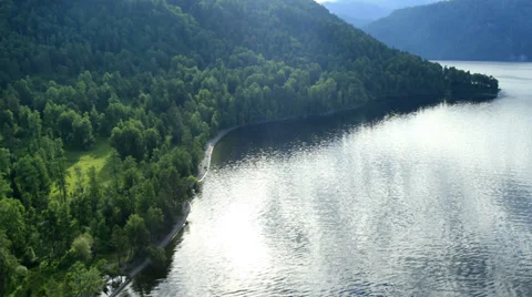 Aerial View. Flying over the mountain lake. Aerial camera shot. Altai, Siberia. Stock Footage 33980538