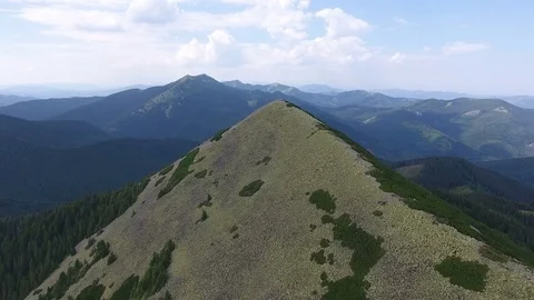 Aerial view: flying over mountain peaks Stock Footage