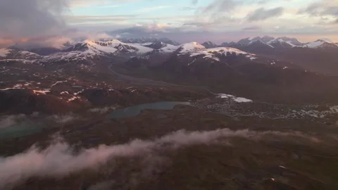 Aerial view of flying over mountain ridge in snow covered mountain Stock Footage 281830284