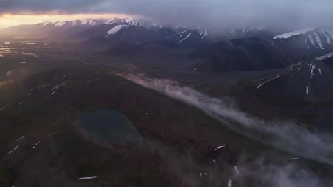 Aerial view of flying over mountain ridge in snow covered mountain Stock Footage 281830348