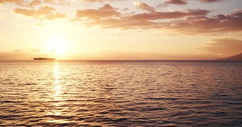 Aerial view flying over ocean into amazing sunset Stock Footage 62847436