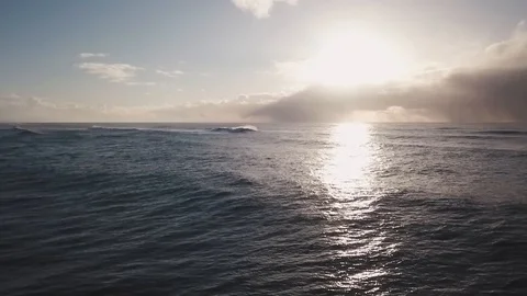 Aerial View Flying Over Ocean Water Towards Sunset 1 Stock Footage 87249592