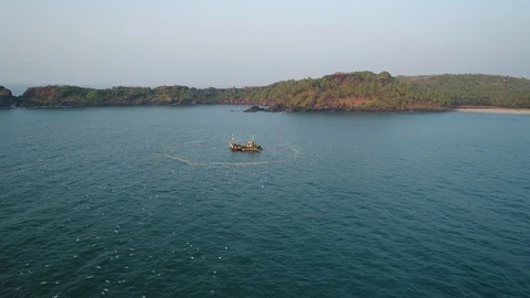 Aerial view. Flying over an old traditional fishing boat and fishing nets in sea Stock-Footage 101984344